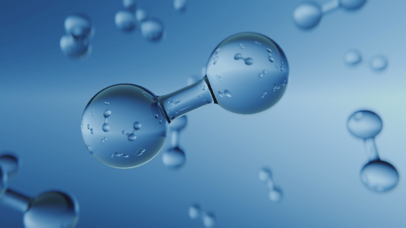 Molecular structure or water droplets rendered in blue, showing interconnected spherical shapes with water-like bubbles